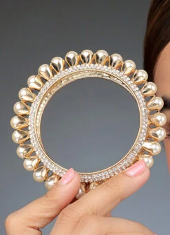 Golden Plated Off White Alloy Stone Pearl Bangles Party Wear